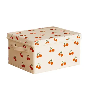 Caja grande de tela beige con tapa y estampado de cerezas para organización en el hogar
