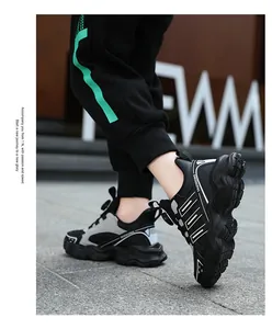 Detail view of kids waterproof chunky sneakers with rotating buckle lacing system