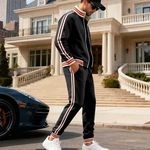 Detailed view of men's premium black fleece tracksuit with classic red and white stripes