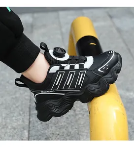 Close-up of waterproof children's chunky sneakers featuring a black and white rotary buckle