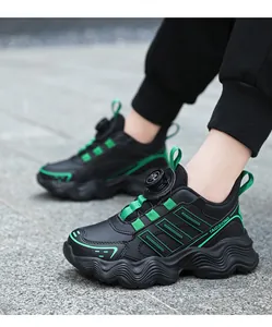 Close-up of children's black and green sneakers featuring a convenient rotary dial closure