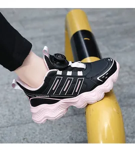 Detailed macro view of children's sports sneaker with rotary buckle and pink sole