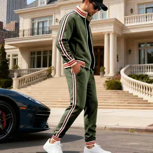 Men's olive green heavyweight fleece tracksuit set with side stripes in luxury setting