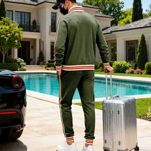 Men's heavy fleece olive green leisure tracksuit two-piece set in a luxury villa pool setting