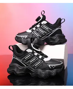 Detail view of black children's leather chunky sneakers with rotary buckle closure system