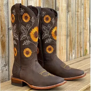 Women's brown western cowboy boots featuring sunflower embroidery and block heel.