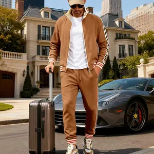 Detail of brown heavy fleece men's tracksuit with striped collar and cuffs.