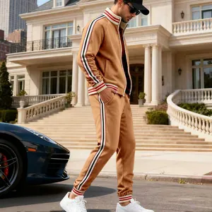 Detailed side view of men's camel fleece tracksuit featuring athletic striped tape