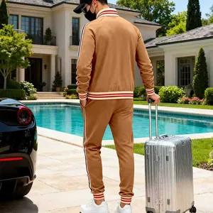 Men's heavy fleece brown tracksuit set with striped details back view in luxury poolside scene