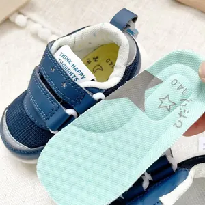 Close-up of lightweight blue baby walking shoes with a removable soft cushioned insole