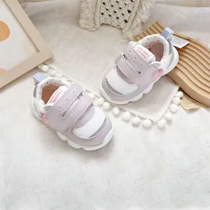 Lightweight pink and white breathable baby walking shoes with double hook loop straps