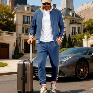 Full view of blue heavy fleece men's tracksuit with side stripe details on a model