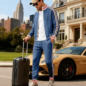 Lifestyle view of men's blue heavy fleece tracksuit with striped trim and matching joggers