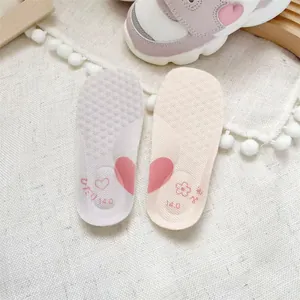 Detailed view of soft baby walker shoe insoles featuring pink hearts and 14.0 cm size marking