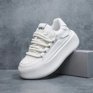 Detailed side view of white platform bread shoes with chunky laces and soft sole