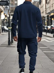 Back view of a men's navy heavyweight fleece cargo tracksuit in urban setting