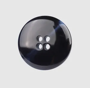 Close-up of a premium black 4-hole resin button for high-end garments and accessories