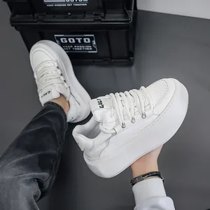 Close-up of white chunky platform sneakers with thick soft soles and urban style