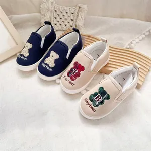 Children's slip-on canvas shoes with cute cartoon bear embroidery in navy and beige colors