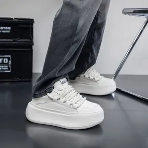 Close-up of trendy white platform sneakers with chunky soles and soft padded design