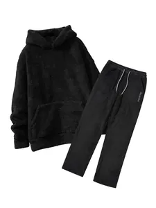 Close-up detail of black coral fleece hoodie and matching pants tracksuit set