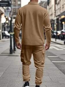 Back view of a khaki heavyweight fleece workwear set with cargo pants in a street setting
