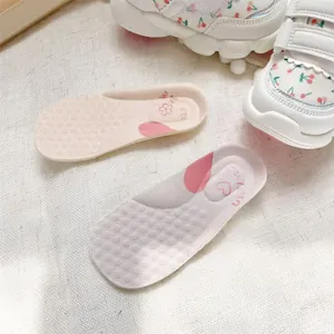Close-up of soft baby walker shoe insoles and white cherry print sneakers