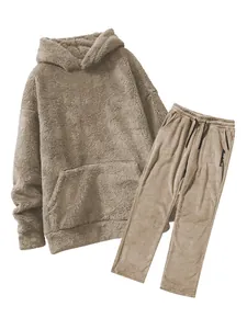 Close-up detail of men's loose fit coral fleece hooded sweatshirt and pants set