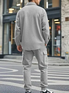 Back view of men's heavyweight gray fleece cargo tracksuit set in street setting