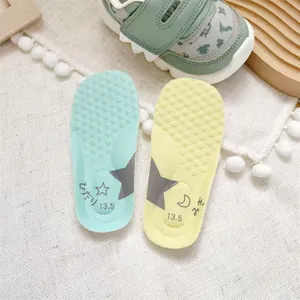 Detailed view of soft anti-slip insoles for baby walking shoes with size 13.5
