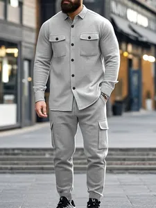 Detail of men's heavy grey fleece workwear jacket and matching cargo pants set