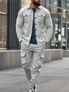 Detail view of a grey heavy-weight fleece cargo sweatshirt set on a model in urban setting.