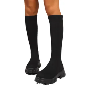 Stylish women's black chunky platform knee-high sock boots with heavy lug sole for autumn winter