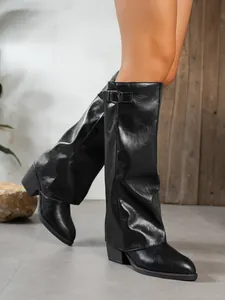 Elegant black pointed-toe pant-leg boots with chunky heels and side buckle detail.
