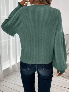 Detail back view of a dark green ribbed knit long-sleeve t-shirt with a relaxed fit