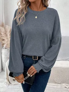 Detail view of women's ribbed knit long sleeve t-shirt with loose fit and round neck