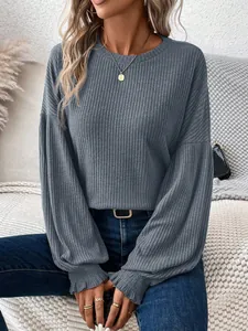 Stylish greyish-blue ribbed long sleeve T-shirt with puff sleeves and ruffled cuffs.