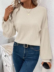 Detail view of women's beige ribbed crew neck long sleeve loose casual t-shirt