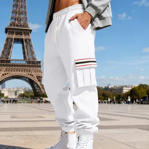 Men's white fleece cargo pants featuring a striped side pocket flap in a Parisian setting