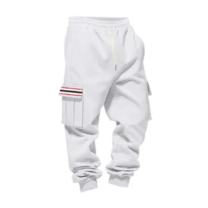 Detailed view of white cargo sweatpants with striped pocket flap and drawstring waist