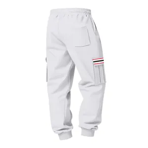 Back view of white fleece cargo pants with striped pocket detail and elastic cuffs