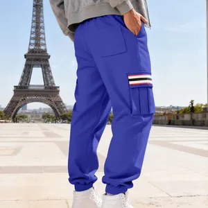 Detail view of blue men's fleece cargo pants with tri-color striped side pocket
