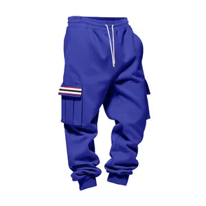 Detail of blue men's fleece cargo sweatpants featuring multi-pockets and striped flap