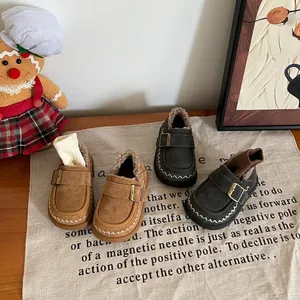 Detailed view of warm fleece-lined toddler girls winter shoes in brown and gray