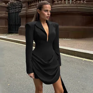 Full body detail of elegant black slim-fit blazer dress with deep V-neck design