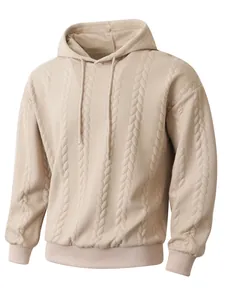 Detailed view of men's beige hoodie featuring a cable-knit jacquard texture and ribbed cuffs.