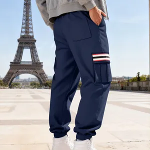 Back detail of navy blue fleece cargo pants with striped side pocket and elastic cuffs.