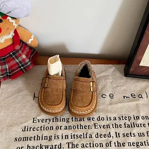 Close-up of toddler winter shoes with warm faux fur lining and suede finish.
