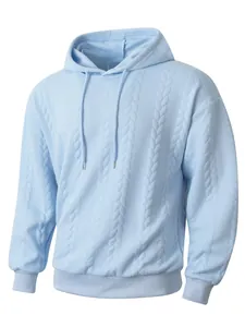 Detail of light blue men's hoodie showing cable-knit jacquard texture and drawstring