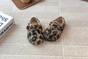 Stylish leopard print furry toddler shoes featuring a button closure and warm plush lining
